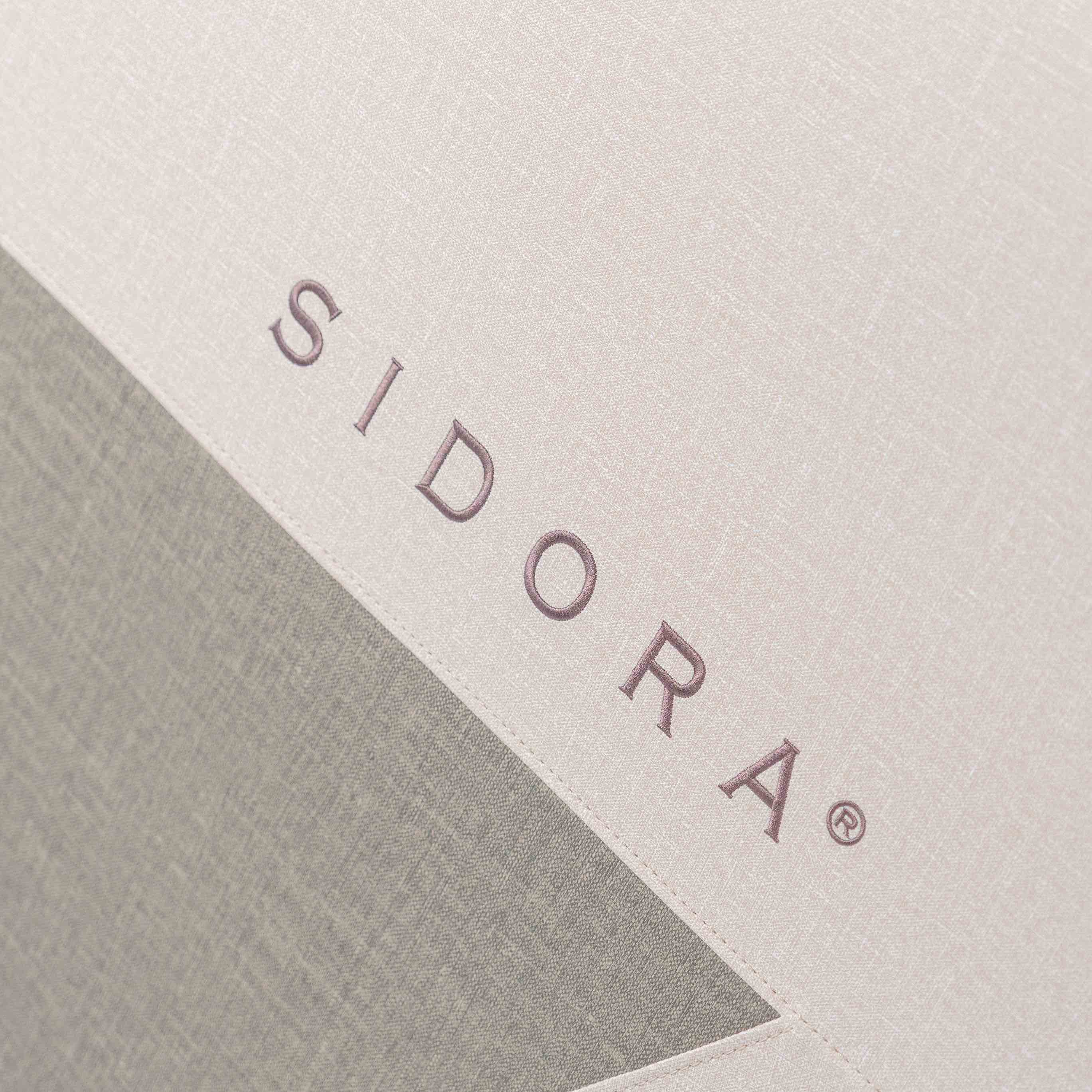 Logo Sidora na boczku fotela masującego Momento