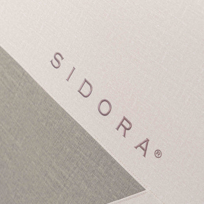 Logo Sidora na boczku fotela masującego Momento