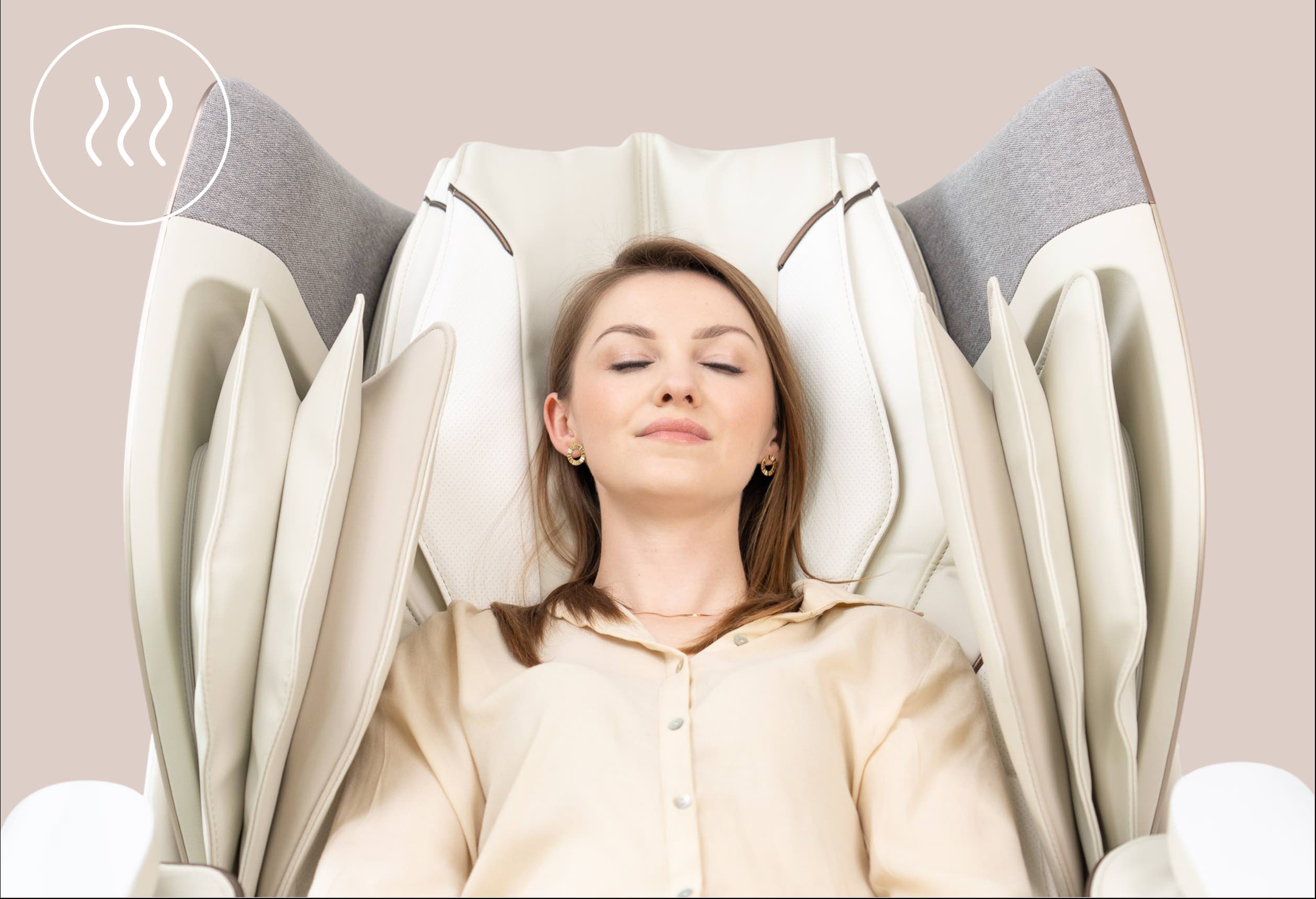 Modelka relaksuje się w fotelu Dreamliner. naniesiony jest piktogram ogrzewania: białe falujące kreski w kółku.